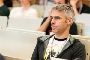 An attendee listening to a talk at Game Dev Days Graz 2018