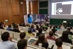Full lecture hall during a talk at Game Dev Days Graz 2018
